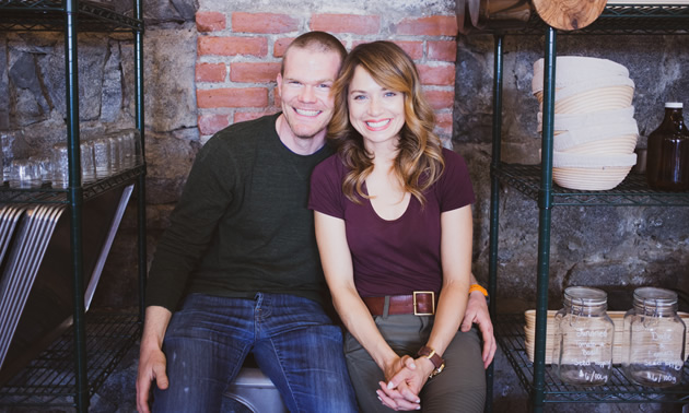 The two owners of The Purist Pantry are shown seated: Todd and Melinda Kopet.