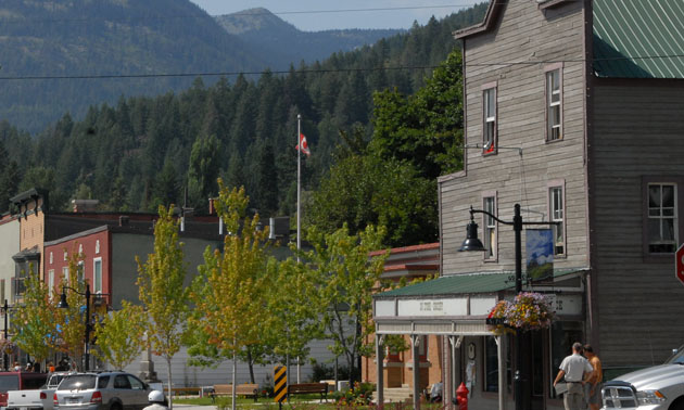 A scenic view of downtown Rossland showing heritage building along street. 