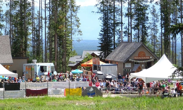 A large group of people, tents and food trucks at the Round the Mountain Festival in Kimberley. 