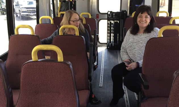 Susan Clovechok (right), executive director of the Columbia Valley Chamber of Commerce, checks out a coach that should soon be engaged to shuttle Columbia Valley residents between the valley and Calgary.