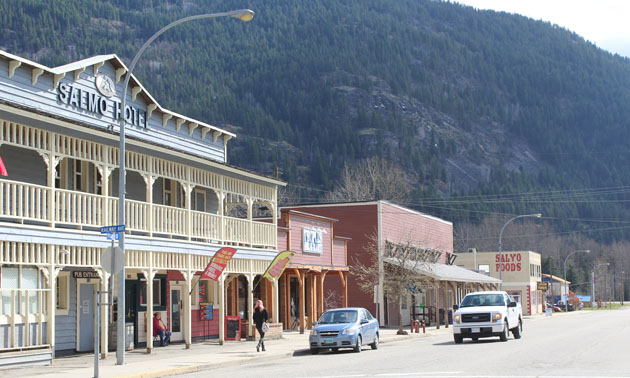 View of Salmo Hotel, parked cars on street 