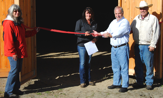 From left, Selkirk Saddle Club vice president Kelly Richards, secretary Tanya Secord, mayor David Raven and club president Hans Michel join in the ribbon cutting for the new indoor riding arena.