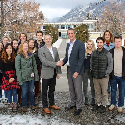 Columbia Basin Trust President and CEO Johnny Strilaeff (middle left) and Selkirk College President and CEO Angus Graeme (middle right) gather in front of Selkirk College’s Castlegar Campus with students from a variety of programs to recognize the new partnership that will innovate and enhance the college experience.