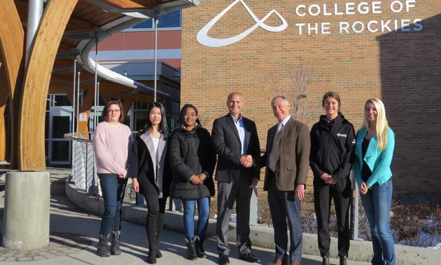 Columbia Basin Trust President and CEO Johnny Strilaeff (middle left) and College of the Rockies President and CEO David Walls (middle right) gather in front of College of the Rockies’ Cranbrook Campus with students from a variety of programs to recognize the new partnership that will innovate and enhance the college experience.