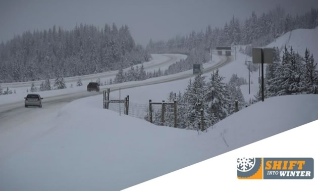 Vehicles travelling on snowy highway, with Shift Into Winter logo. 