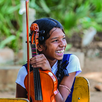 A young girl in Sri Lanka participating in The Music Project.