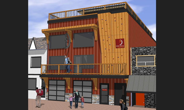 An artist rendering of a red building with decks out from that lead to an outdoor climbing wall.