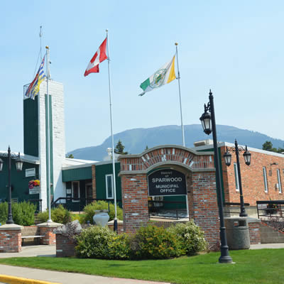 Flags fly over the Sparwood municipal building that is home to the District of Sparwood's administrative team
