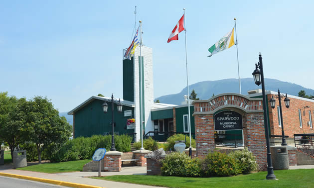 Flags fly over the Sparwood municipal building that is home to the District of Sparwood's administrative team