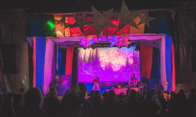 Colourful lit stage at the Starbelly Jam Festival. 