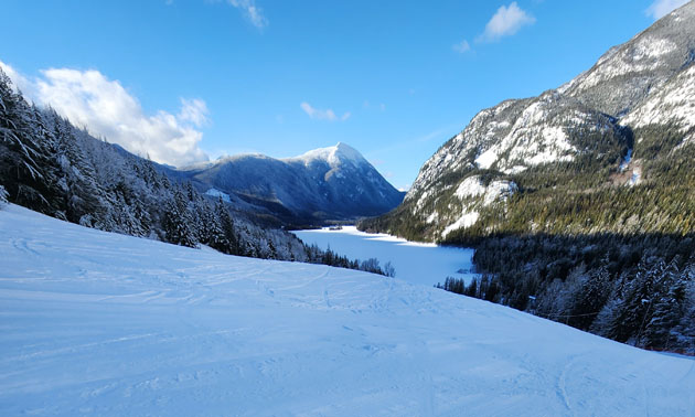View of Summit Lake Ski area, showing snowy mountains. 
