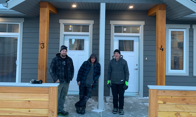 Kris Newman and his team pictured at the Parkside Place Project, building is half-finished. 