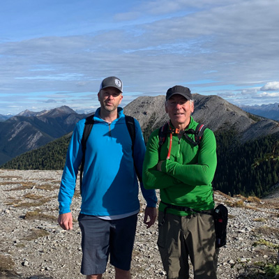 Kevin Blackwell and Kris Newman, mountain views in background. 