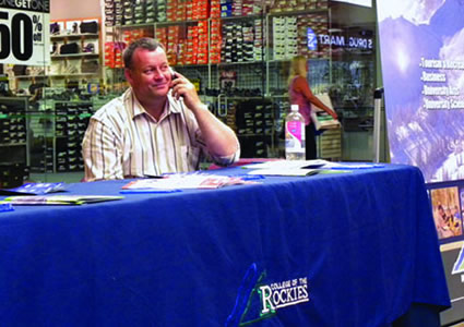 Photo of Recruitment Officer, Hugh Moore, prepared to provide information to patrons of the Tamarack Centre Mall.