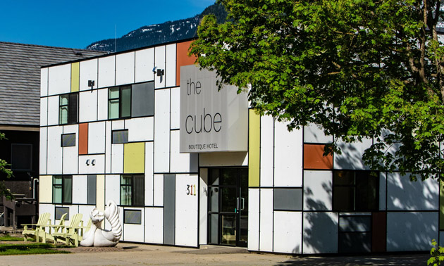 Outside view of the front of the Cube Hotel, decorated with cubist style art. 