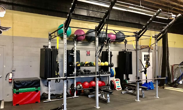 Interior of gym with exercise equipment. 