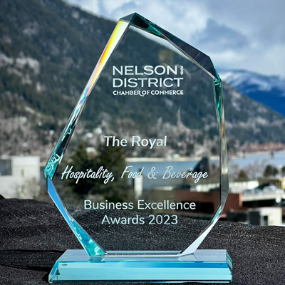 Glass 2023 Business Excellence award, City of Nelson in background of photo. 