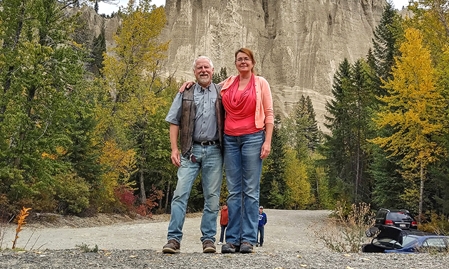 Lorri and Chris McCready, founders of Thör’s Pizzeria, stand in front of rock formations in the Kootenays.