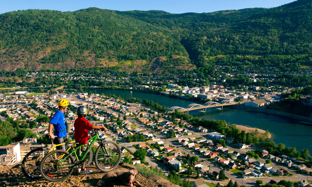 Aerial view of Trail, with two mountain bike riders in foreground. 