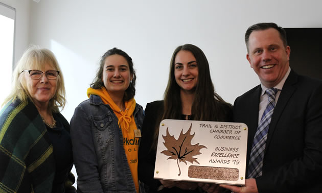 The West Kootenay EcoSociety accepts the award for Business of the Year. Pictured are (L to R) Audry Durham, board member; Alyssa Taburiaux, Trail outreach co-ordinator; Natasha Edmunds, community organizer; and Trail councillor Paul Butler.