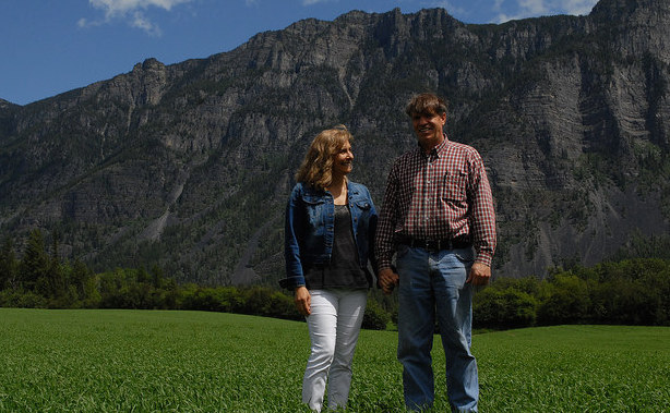 Ben and Claudia Herrera are standing in one of their wheat fields in Creston, B.C.