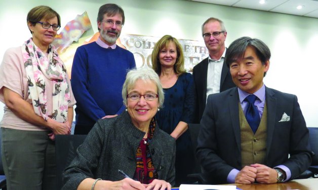 College of the Rockies Vice-President Academic & Applied Research Stan Chung and Dr. Catherine Mateer from UVic sign two new partnership agreements as (l-r) Dean of Instruction Heather Hepworth, Dean of Instruction Darrell Bethune, Director of Student Affairs Doris Silva and Dean of Instruction Jack Moes look on.