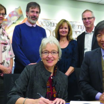 College of the Rockies Vice-President Academic & Applied Research Stan Chung and Dr. Catherine Mateer from UVic sign two new partnership agreements as (l-r) Dean of Instruction Heather Hepworth, Dean of Instruction Darrell Bethune, Director of Student Affairs Doris Silva and Dean of Instruction Jack Moes look on.