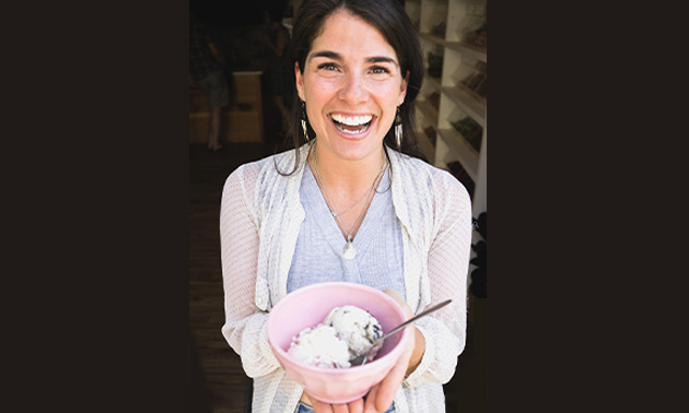 Amy Orlando, owner of the Revelstoke Sugar Shack, holding a bowl of ice cream