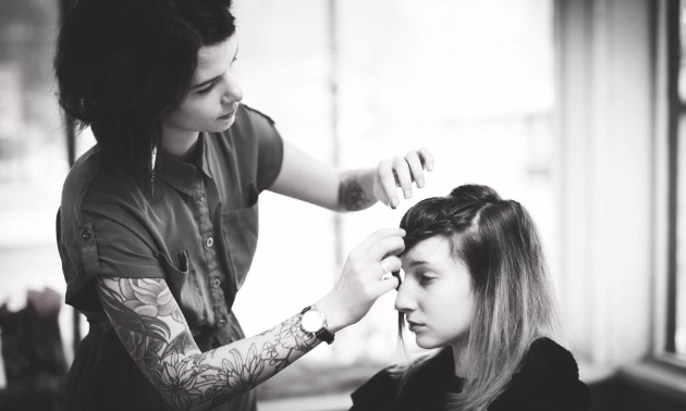 Sara Sansom, owner of Birch & Lace, cutting a customers hair.