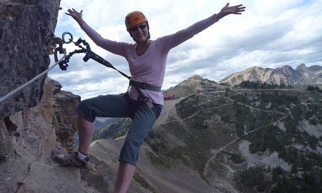Joanne Sweeting, executive director of Tourism Golden, embraces the Via Ferrata at Kicking Horse Mountain Resort in Golden, B.C.