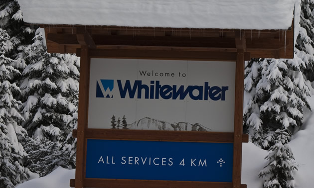 Snow-capped sign saying Whitewater Ski Resort