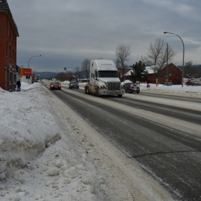 Vehicles drive down Highway 95 in Cranbrook.