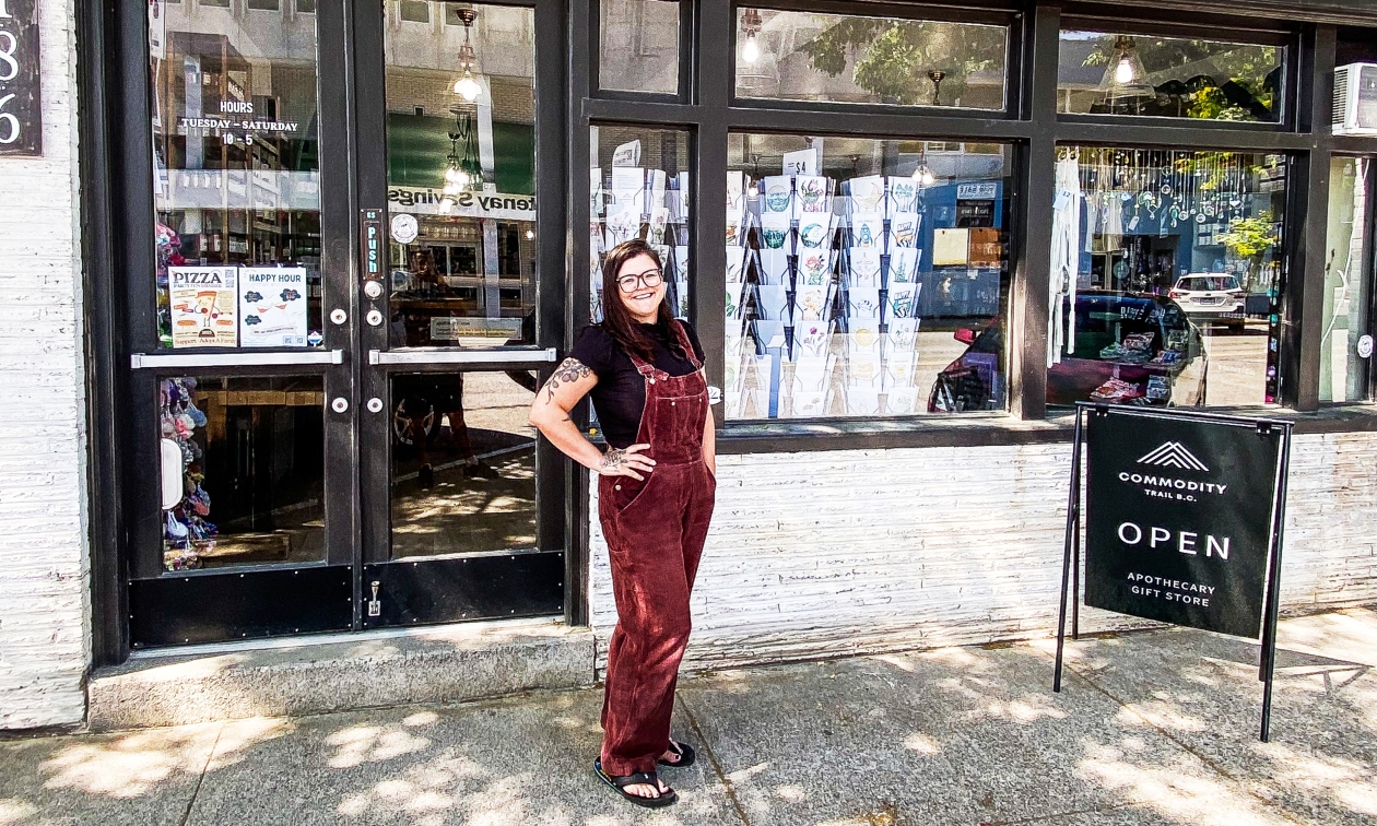 Ash standing in front of her store