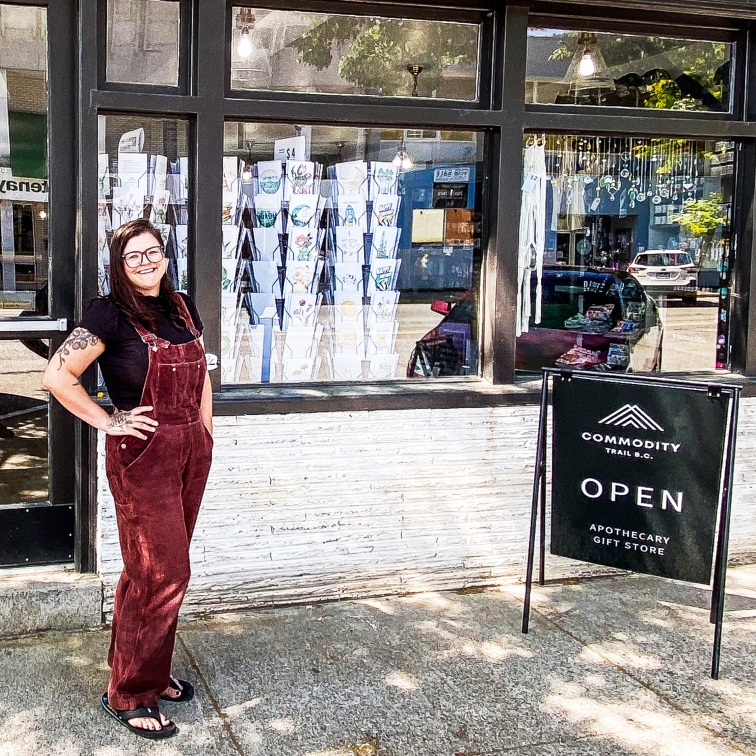 Ash standing in front of her store