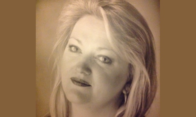 A sepia head photo of Audrey Bisset.