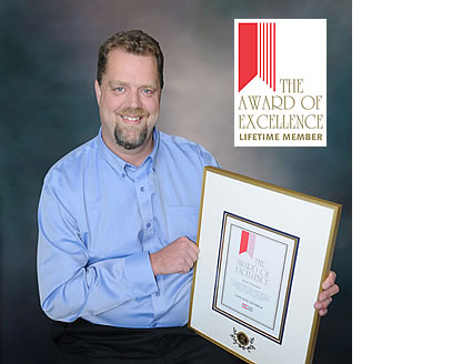 Jason Wheeldon holding a plaque