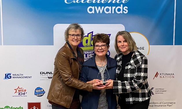 Owner of Life Balance with two other ladies accepting chamber of commerce awards