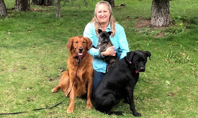 three dogs and a lady - owner of unleashed, Amber Schick