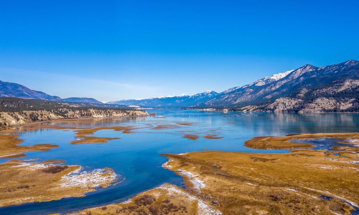 overview of blue waterways, blue sky and mountains