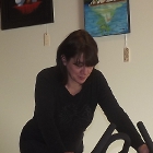 woman on an exercise bike in a gym
