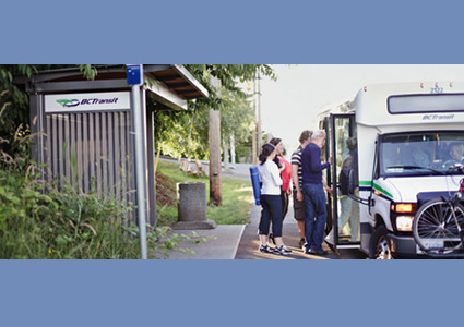 Photo of people getting on a bus