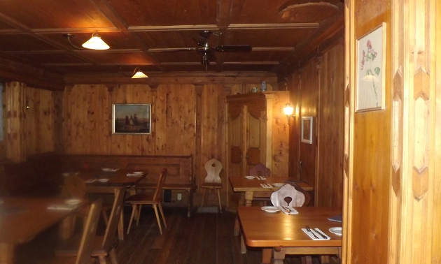 interior of a wood building with restaurant seating
