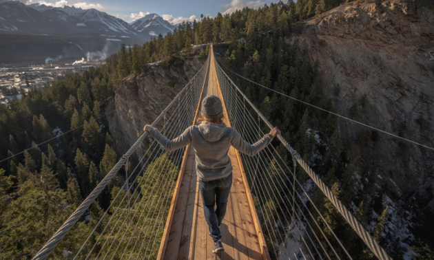 Lady on a spanning bridge in Golden, BC