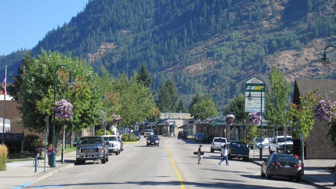 Castlegar's downtown street with deciduous trees lining it