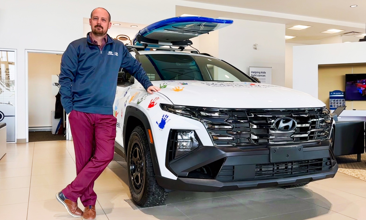 Dave Moodie standing in front of a white vehicle