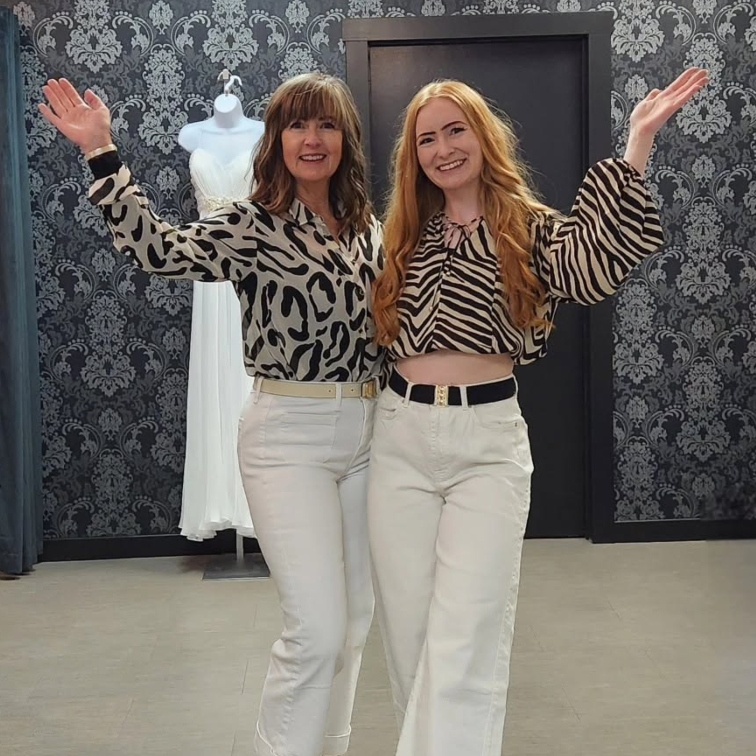 Two women showing a dressing room at Closet 31