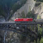 Photo of a coal train crossing a bridge