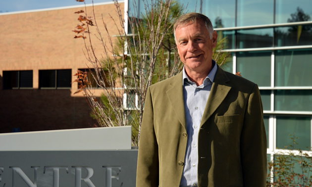 David Walls, president and CEO of College of the Rockies stands in front of the main campus in Cranbrook. 