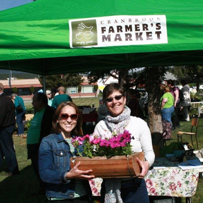 Picture of Livia Lara, new manager of the Cranbrook Farmer's Market, and Erna Jensen, previous manager. 