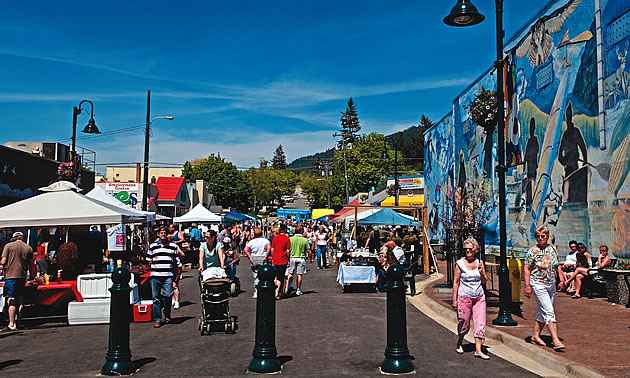 people gathering at a festival event in Creston, BC